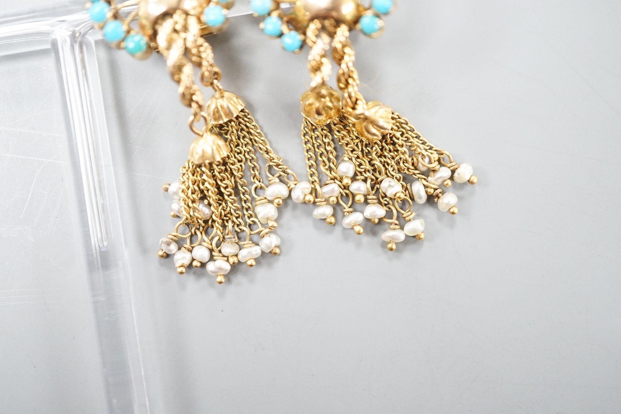 A pair of 20th century Middle Eastern yellow metal, seed pearl and turquoise set tassel drop ear clips, 47mm, gross weight 12.5 grams.